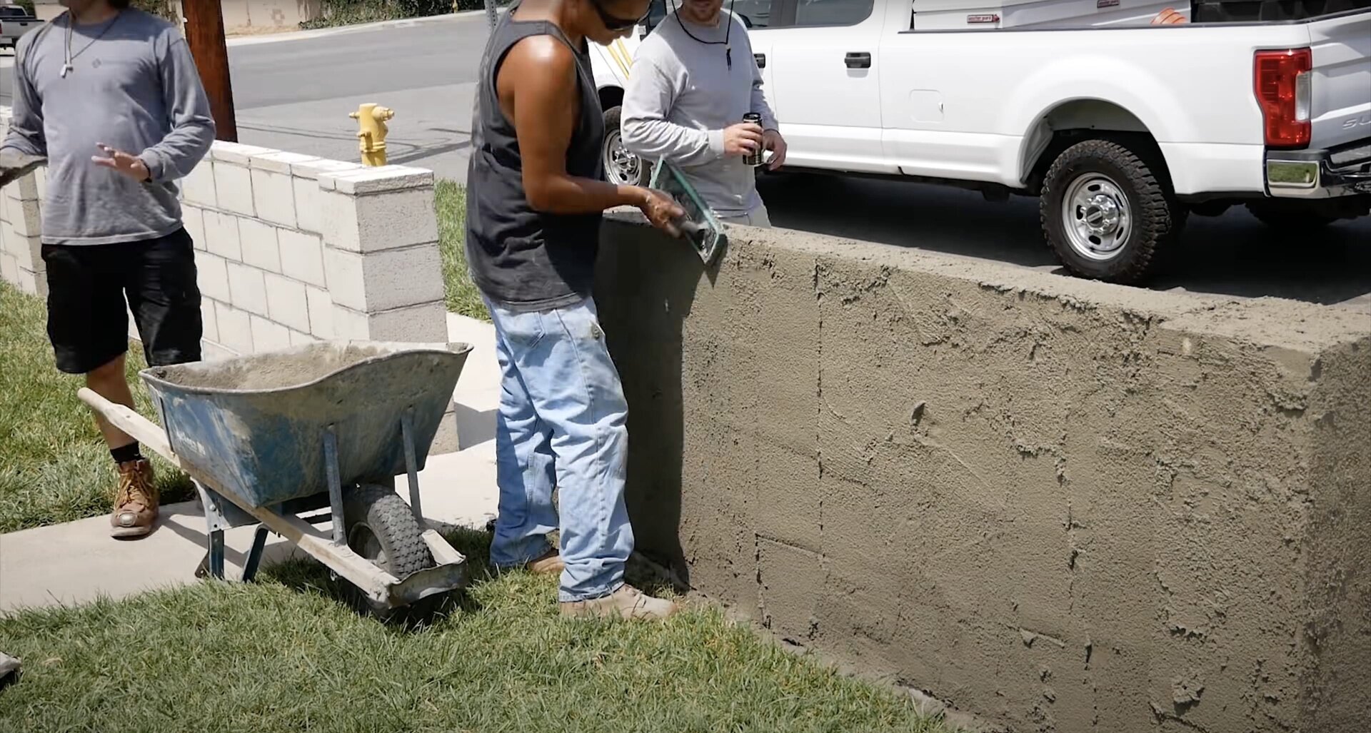 Professional concrete pouring process by Quincy Concrete team Concrete contractor team mixing and pouring concrete for residential project