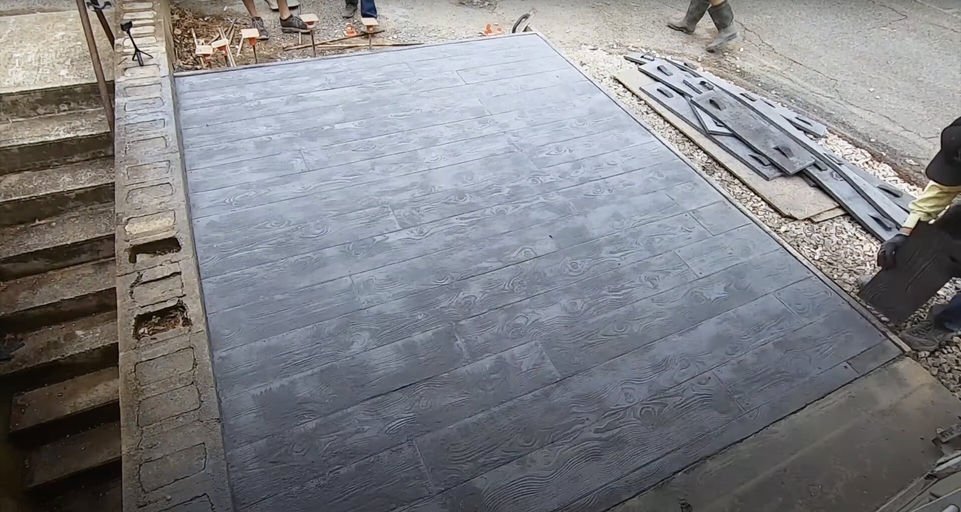 Beautiful decorative stamped concrete installation Decorative stamped concrete with wood grain pattern